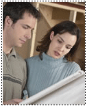 two people looking at plans